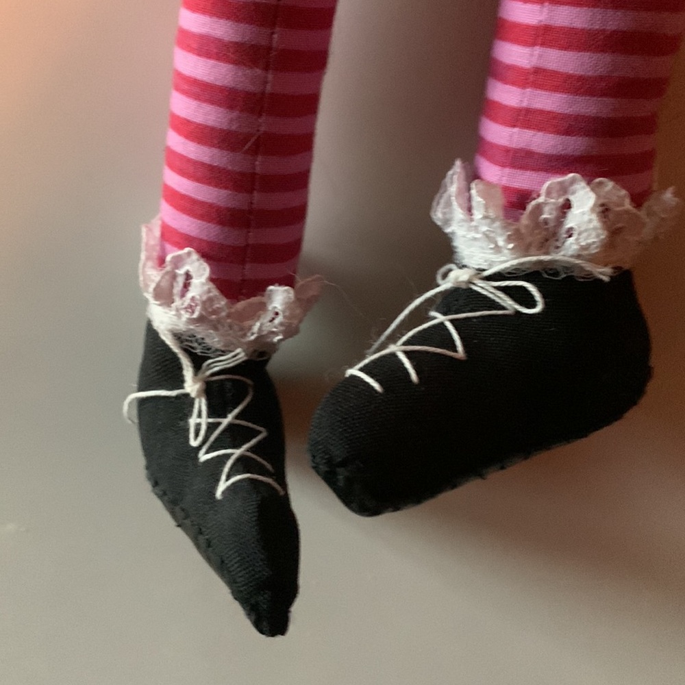 Charming handmade cotton doll. Dangly legs and whimsical smile. Never used.